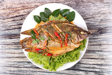 Curry-fried Tilapia fish with spicy topping.