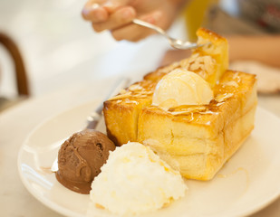 Honey toast with chocolate and vanilla ice-cream, whippe cream.