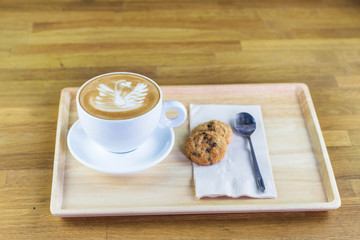 A cup of hot coffee late art in coffee shop