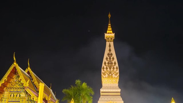 Time-lapse of Wat Phra That Phanom temple at twilight, Nakhon Phanom, Thailand
