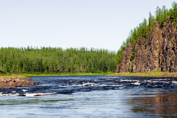 The rocky shore of a large river. Big river of Eastern Siberia. Krasnoyarsk region.