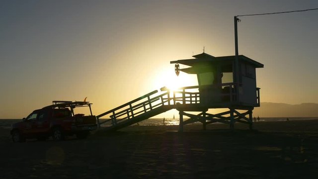 sunset time los angeles veniece beach lifeguard tower and car 4k usa

