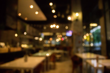 Blur coffee shop or cafe restaurant with abstract bokeh light 