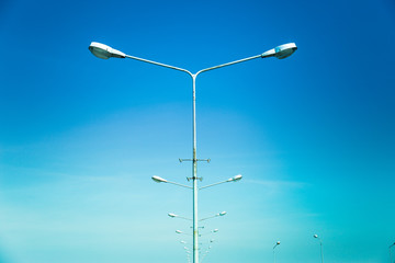 Light post isolated with blue sky background