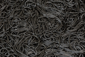 Black dried noodles soaked in a cuttlefish ink