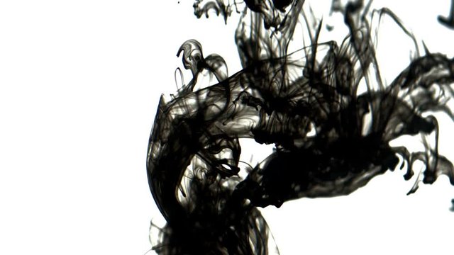 Black inks in water 4K. A drop of black ink in water in slow motion 
