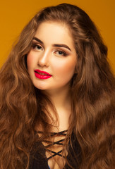 Naklejka premium portrait of a beautiful brown-haired woman with long hair