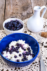 Healthy food: cottage cheese with frozen blueberries