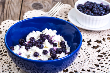 Healthy food: cottage cheese with frozen blueberries