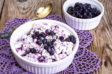 Healthy food: cottage cheese with frozen blueberries