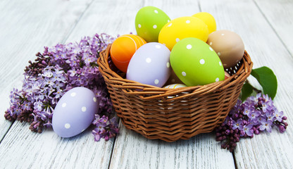 easter eggs and fresh lilac flowers