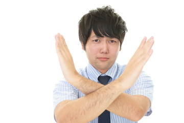 禁止の意思表示をする男性