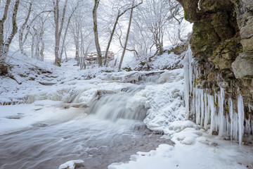 Fototapeta na wymiar Stream with icicles