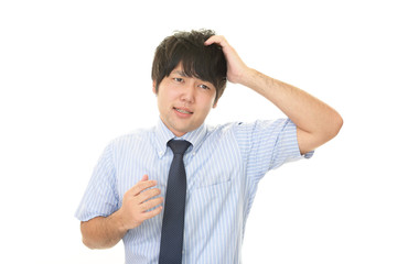 困惑した表情のビジネスマン