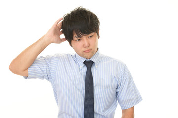 悩むビジネスマン