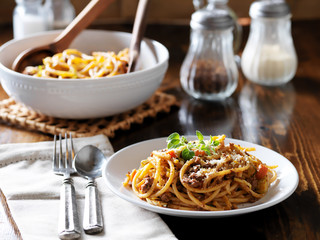 spaghetti dinner with beef, parmesan and oregano