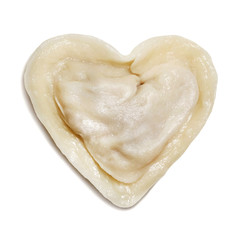 Dumpling in the form of heart on a white background