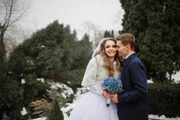 Someone special lovely wedding couple in love at winter day.