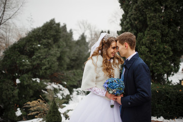 Someone special lovely wedding couple in love at winter day.