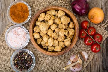 Grude soybean stew on the background of wooden boards