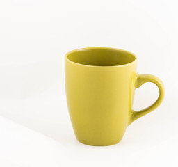 green cup on white background