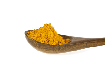 Turmeric powder in wooden spoon on a white background. Curcuma p