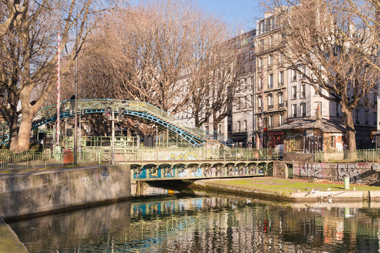 Paris, canal Saint-Martin, a bridge on the quay in winter 