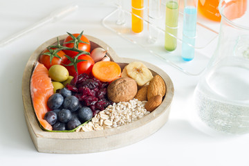 Test food ingredients in laboratory concept with healthy food in heart
