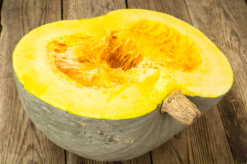 Gray pumpkin cut in half, pulp and seeds