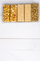 Kozinaki with seeds, nuts, sesame seeds and honey