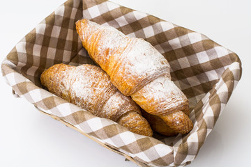 Fresh soft croissant on a white background
