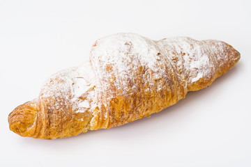 Fresh soft croissant on a white background