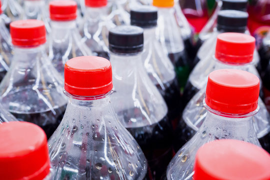 Carbonated soft drink bottles close up