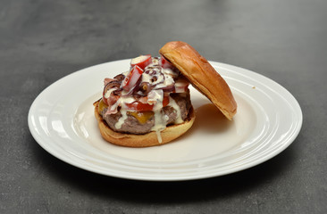 look inside tasty hamburger on white plate