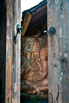 Wooden Ganesha behind the doors