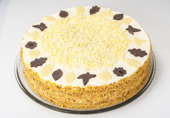Honey cake with whipped cream and white chocolate