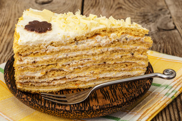 Honey cake with whipped cream and white chocolate