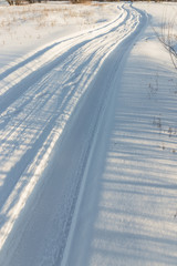 Obraz premium cars on the road in the deep snow