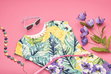 Fashion girl clothes set, Accessories. Summer street style. Design Trendy fashion sunglasses. Summer floral dress, spring flowers. Summer fashion lady. Creative urban. Perspective view