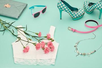 Fashion Design Spring girl clothes set,accessories. Trendy sunglasses, lace top, fashion handbag clutch, flowers.Glamor shoes heels.Summer lady.Creative urban.Pastel spring colors.Perspective view