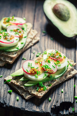 Crispy bread with avocado, radish and eggs