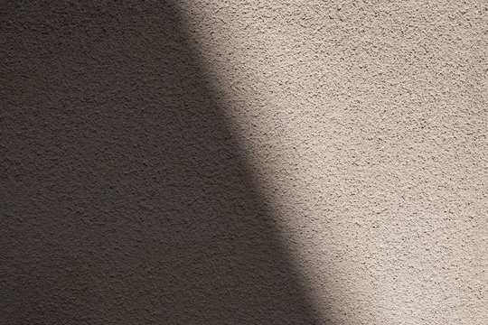 Dark and bright side of wall texture with shadow
