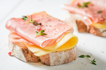 Crisp a piece of wholegrain bread with cheese and ham
