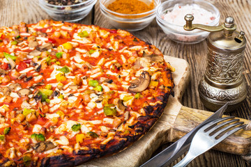 Vegetarian pizza with tomatoes and mushrooms