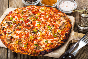 Vegetarian pizza with tomatoes and mushrooms