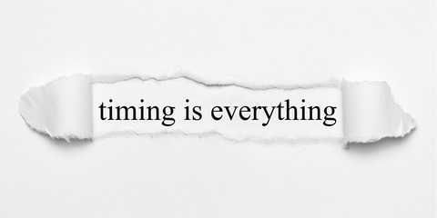 timing is everything on white torn paper