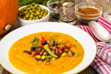 Spicy vegetable cream soup with vegetables