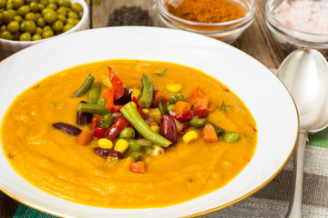 Spicy vegetable cream soup with vegetables