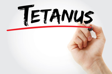 Hand writing Tetanus with marker, health concept background