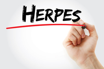 Hand writing Herpes with marker, health concept background